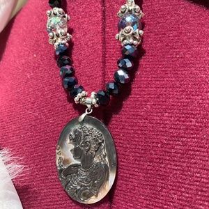 Genuine, carved abalone shell cameo pendant